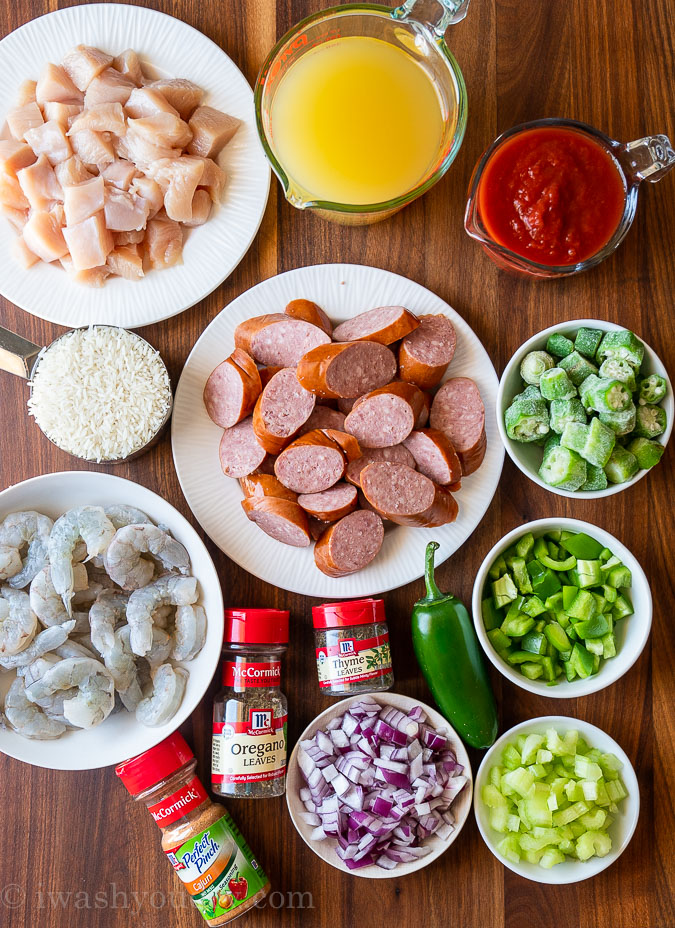 ingredients for jambalaya recipe on wooden surface