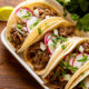 slow cooker barbacoa beef in taco shells with radish