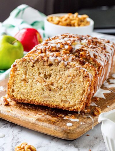 Slices of apple fritter bread on wood cutting board