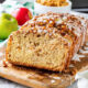 Slices of apple fritter bread on wood cutting board