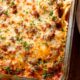 cheesy ravioli casserole in glass dish