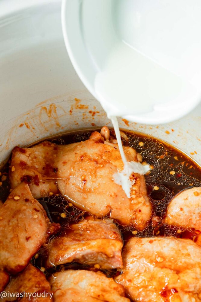 pouring cornstarch slurry into crockpot 