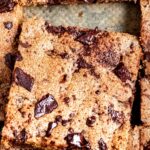 chocolate chip blondie in pan with extra chocolate