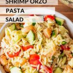 White bowl of shrimp orzo salad.