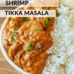 Cooked Shrimp Tikka Masala in white bowl.