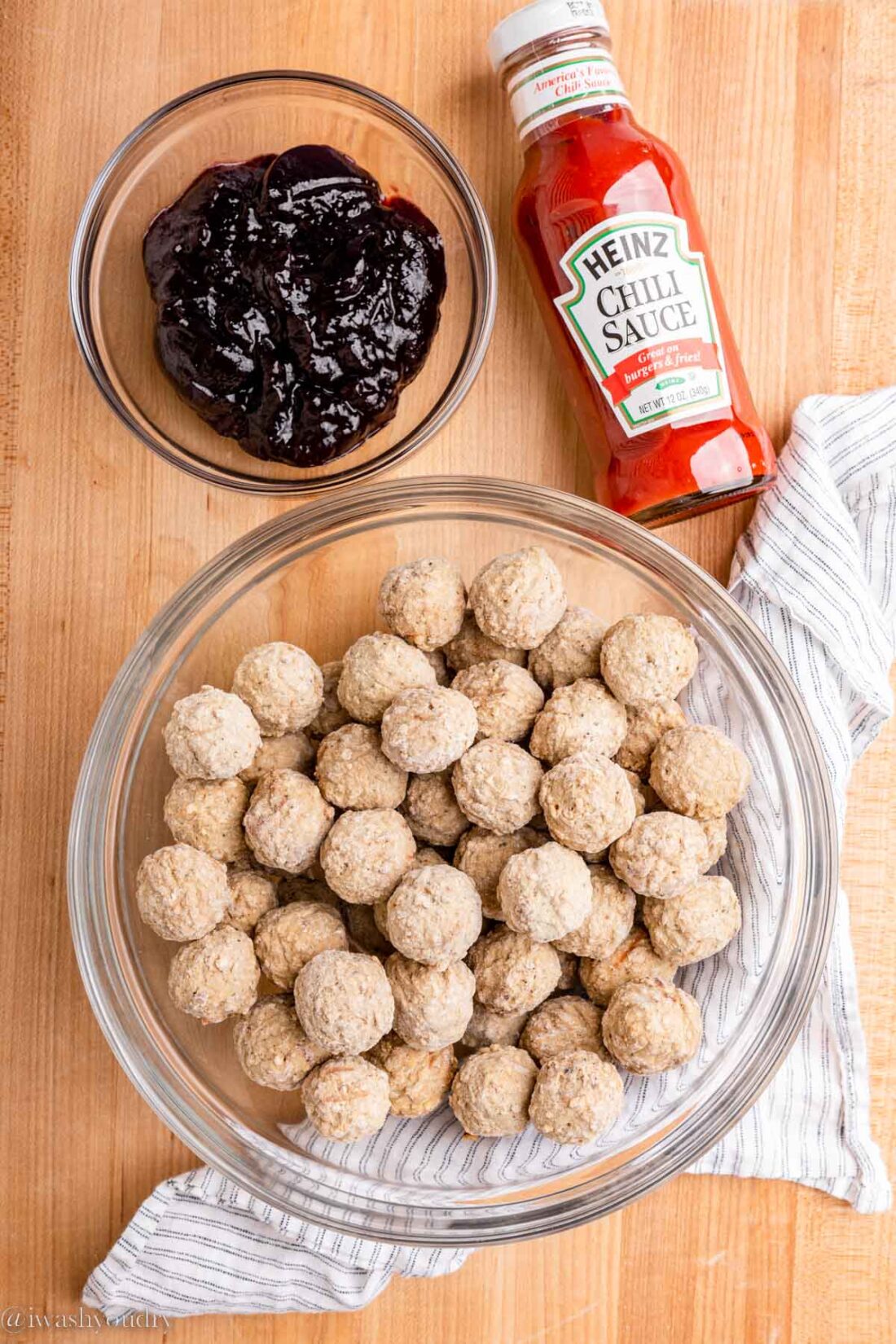 Ingredients for 3 ingredient cocktail meatballs on wood coutertop. 