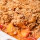 Easy Peach Crisp in white baking dish