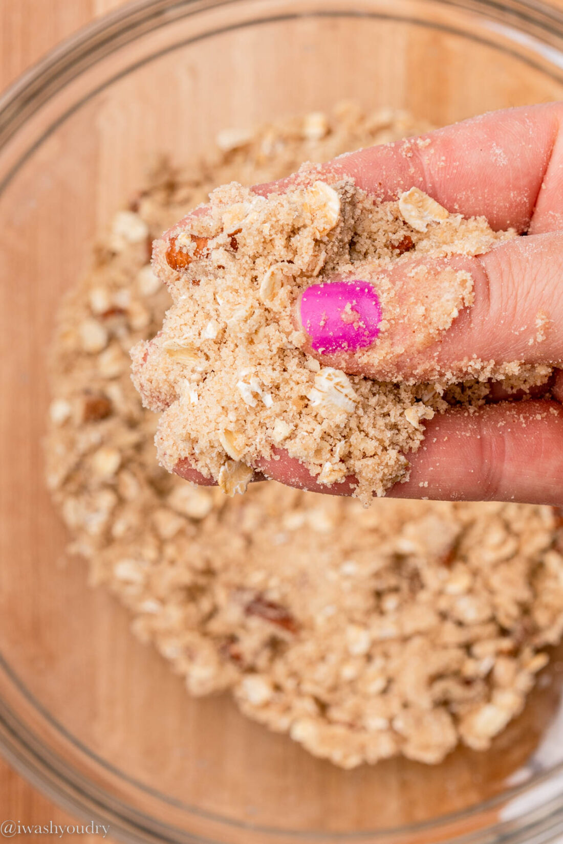 Hand holding peach crumble