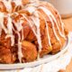 Baked pull apart monkey bread on white plate