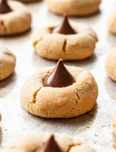 Baked Chocolate Kiss Cookies on a metal baking sheet.