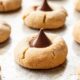 Baked Chocolate Kiss Cookies on a metal baking sheet.