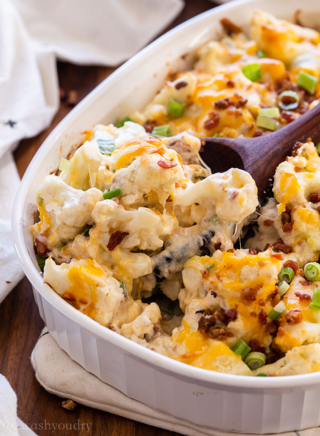 wooden spoonful of cauliflower casserole