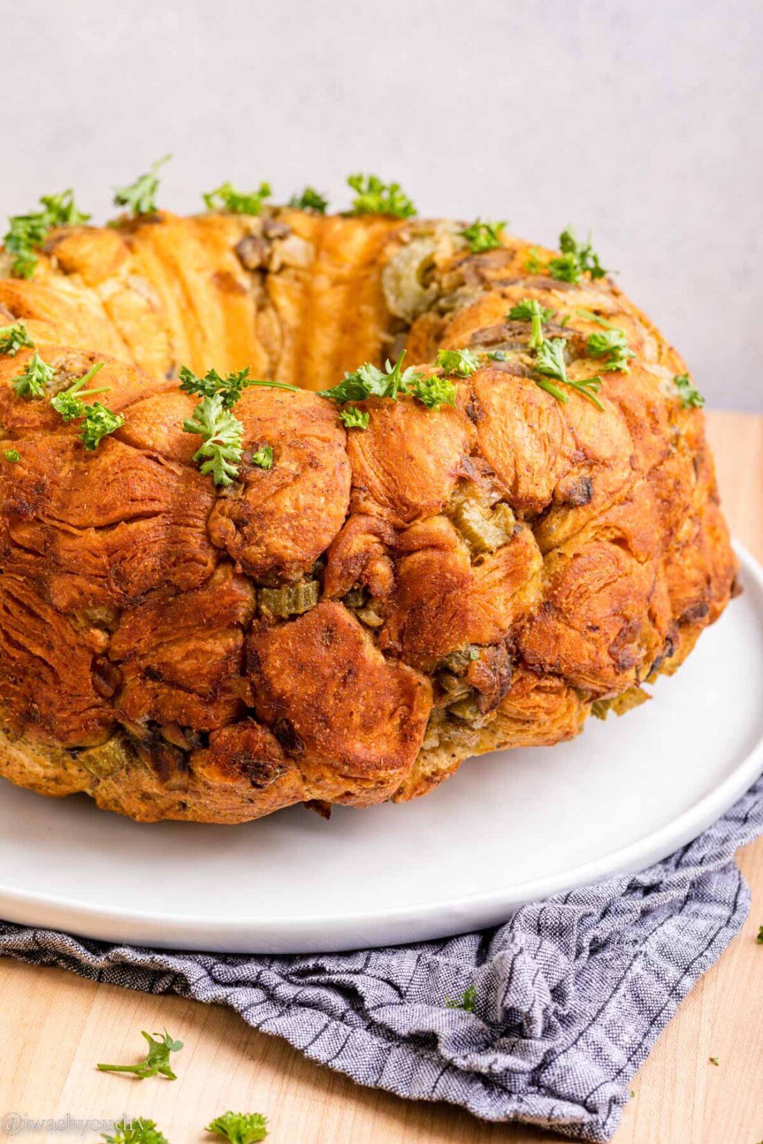 Baked Pull Apart Stuffing ring on white plate. 