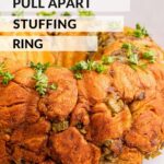 Baked pull apart stuffing ring on white platter.