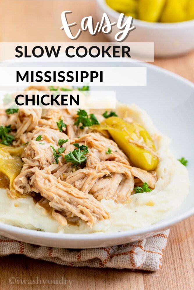 Cooked slow cooker mississippi chicken on white plate.