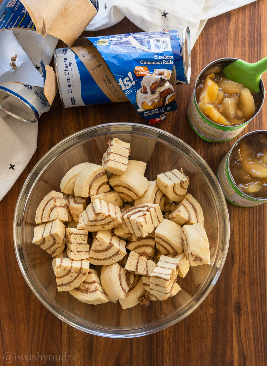 quartered cinnamon rolls in a large bowl.