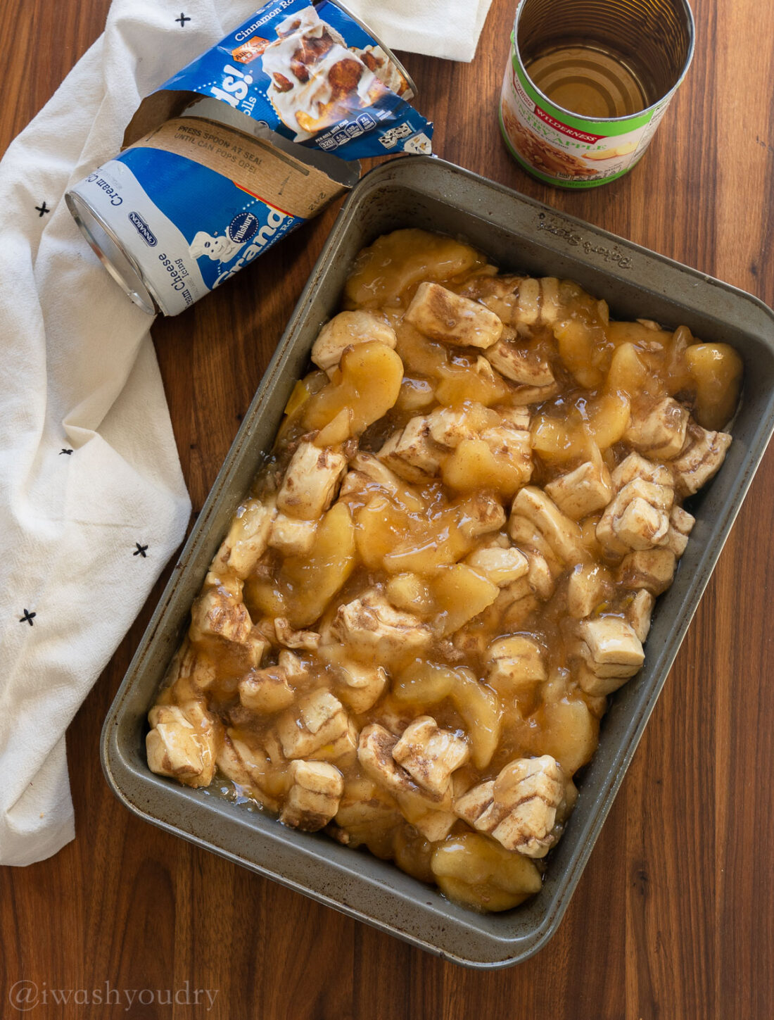 apple cinnamon rolls unbaked in baking dish.