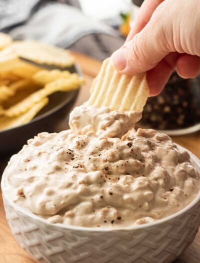 potato chip with onion chip dip on it.