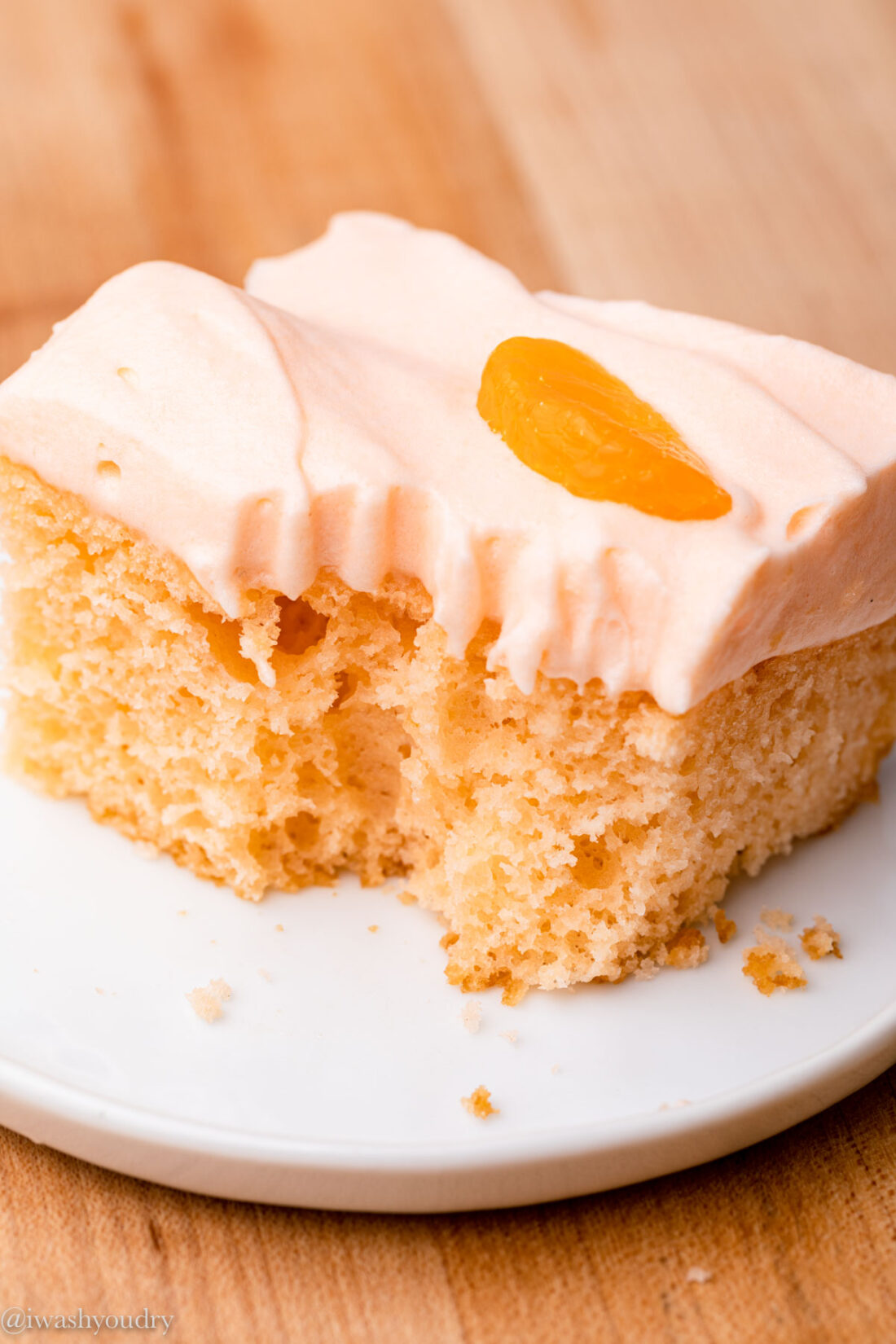 slice of orange soda cake with bite taken out of it 