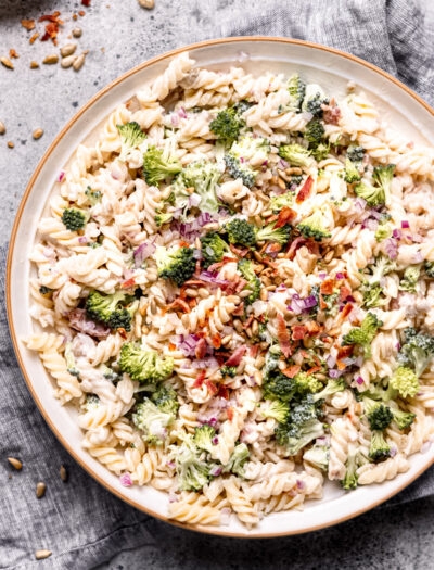 bowl of pasta salad with broccoli and bacon.