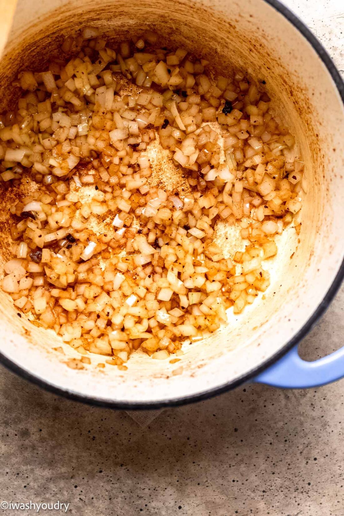 Cooked onions and garlic in ceramic pot. 