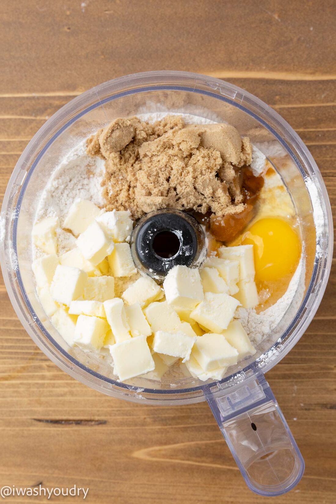 Ingredients for pumpkin pie bar crust in bowl of food processor. 