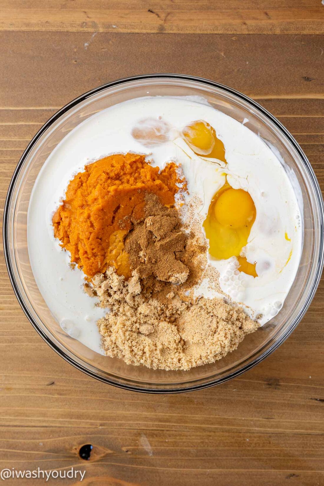 Ingredients for pumpkin filling in a glass bowl. 