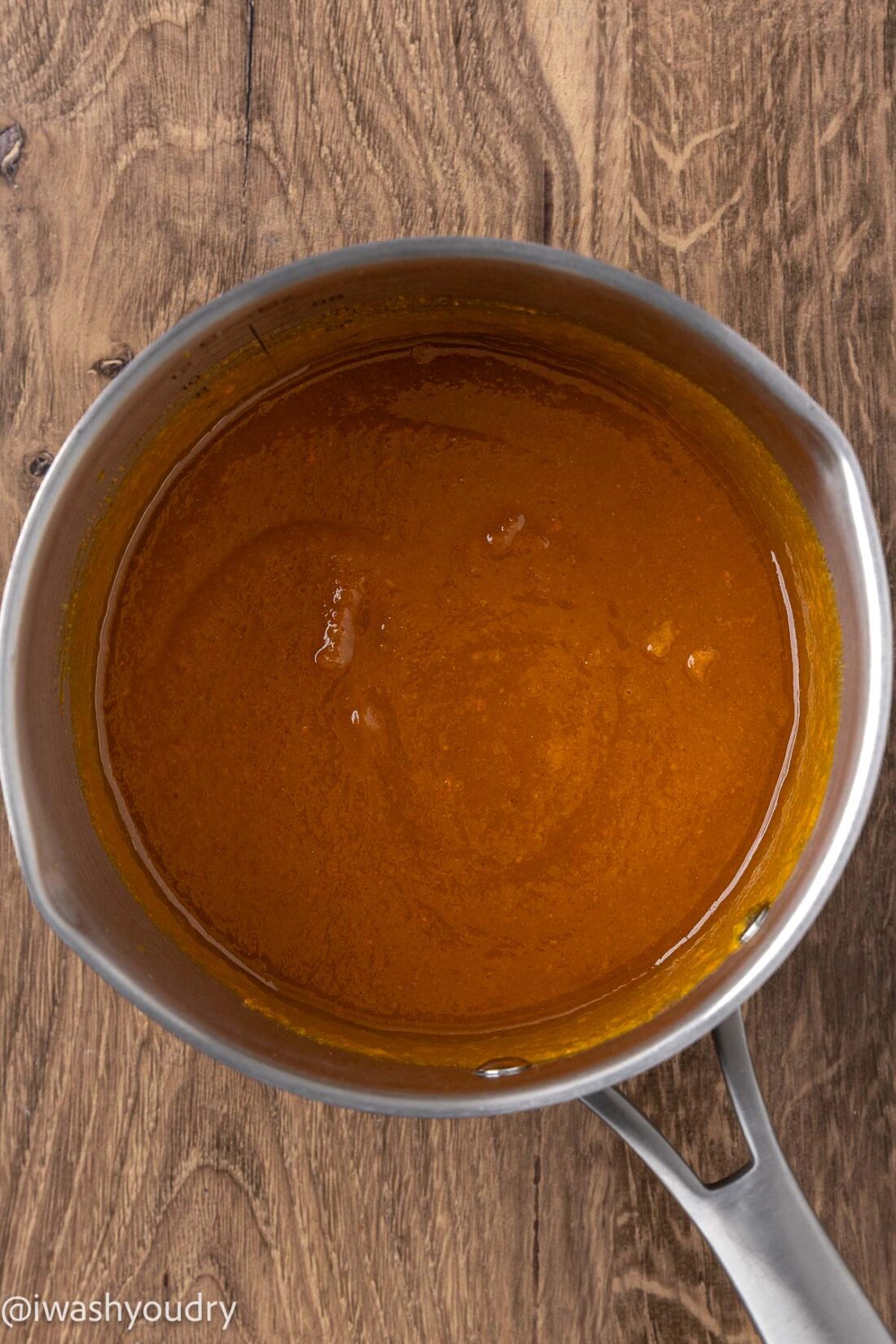 Cooked pumpkin butter in metal pan. 