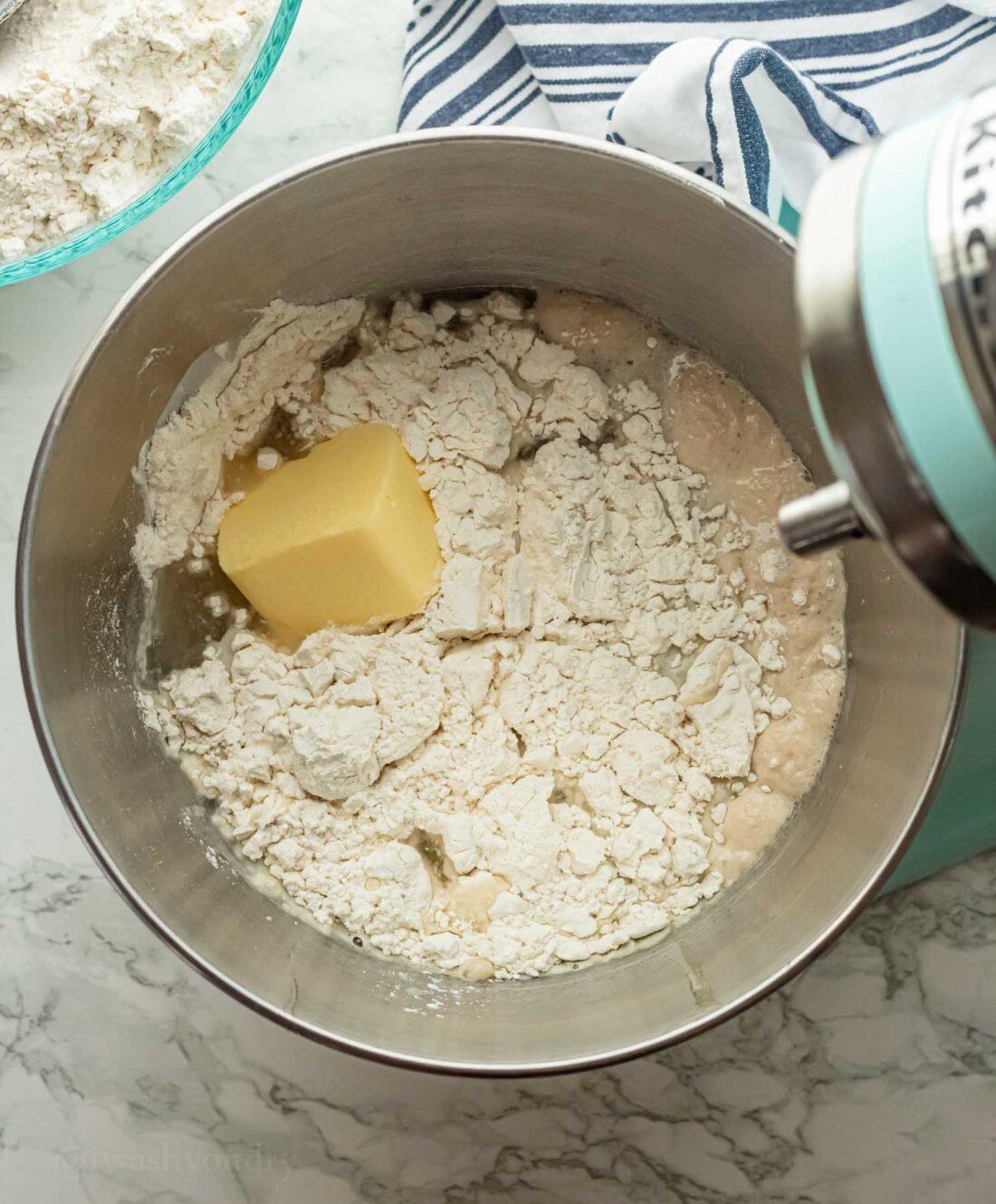 Crisco and flour in metal bowl with yeast and water. 