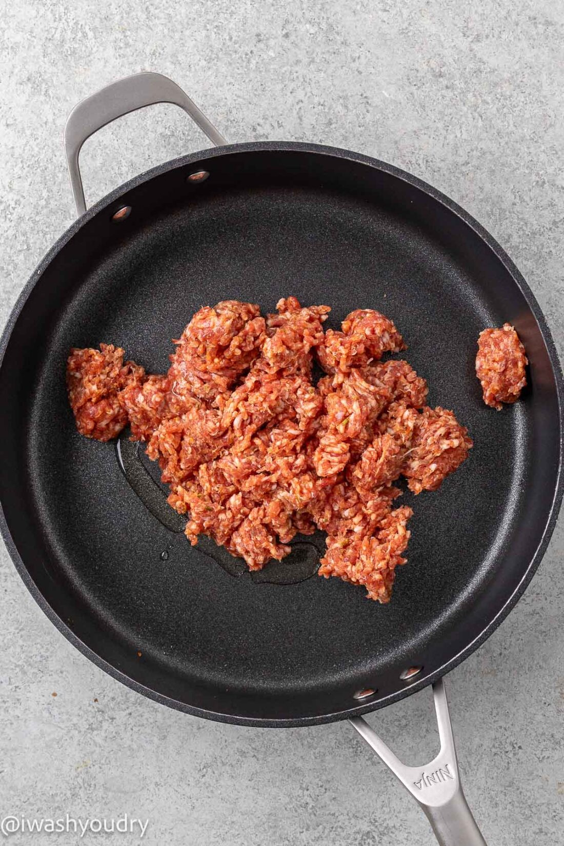 Raw ground sausage in metal pan. 