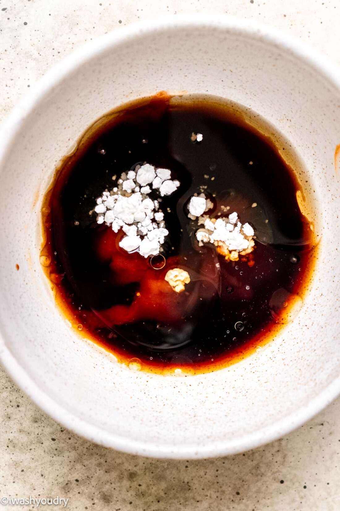 Ingredients for chicken stir fry sauce in white bowl. 