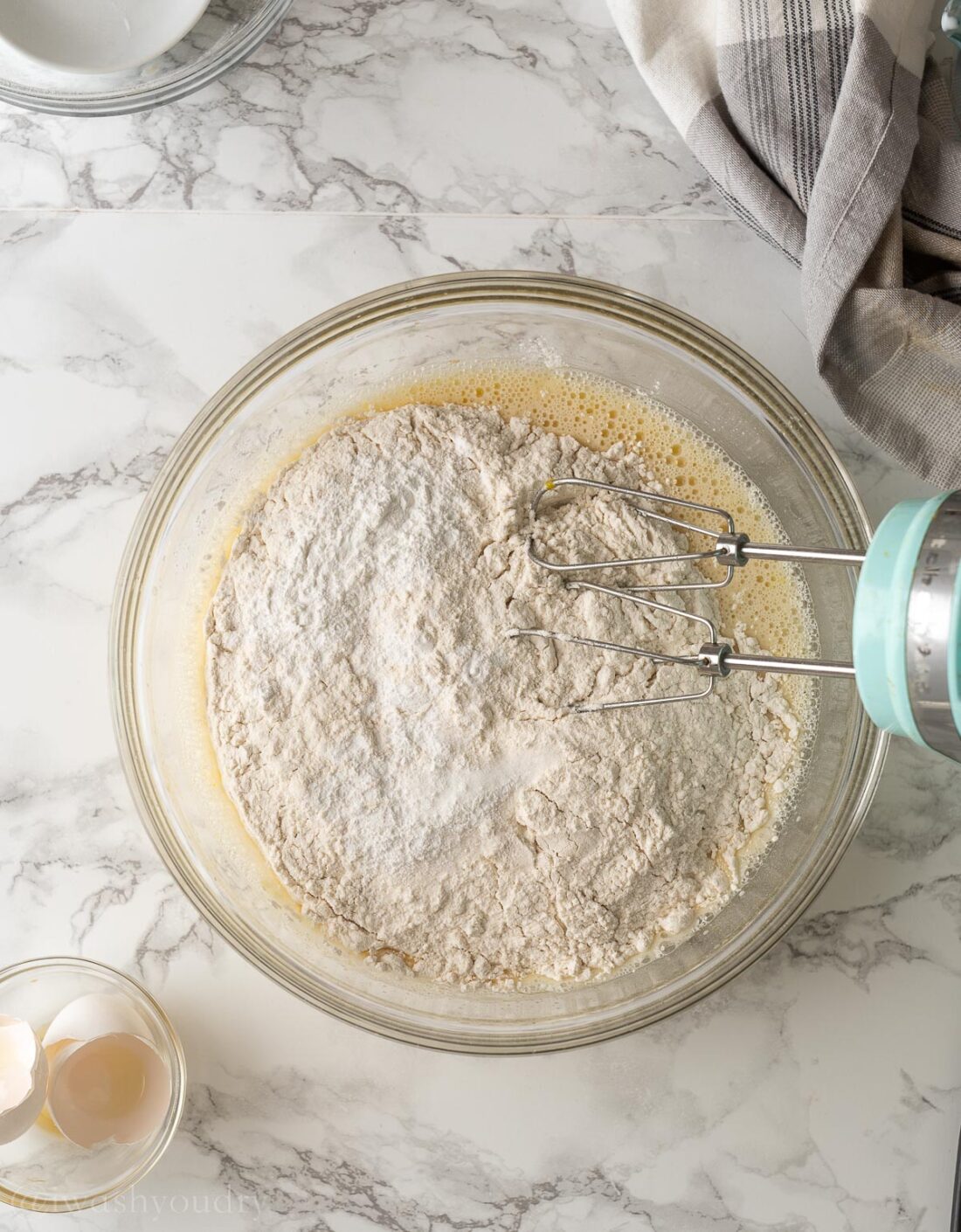 Flour baking soda, and salt in glass bowl with wet ingredients and whisk. 