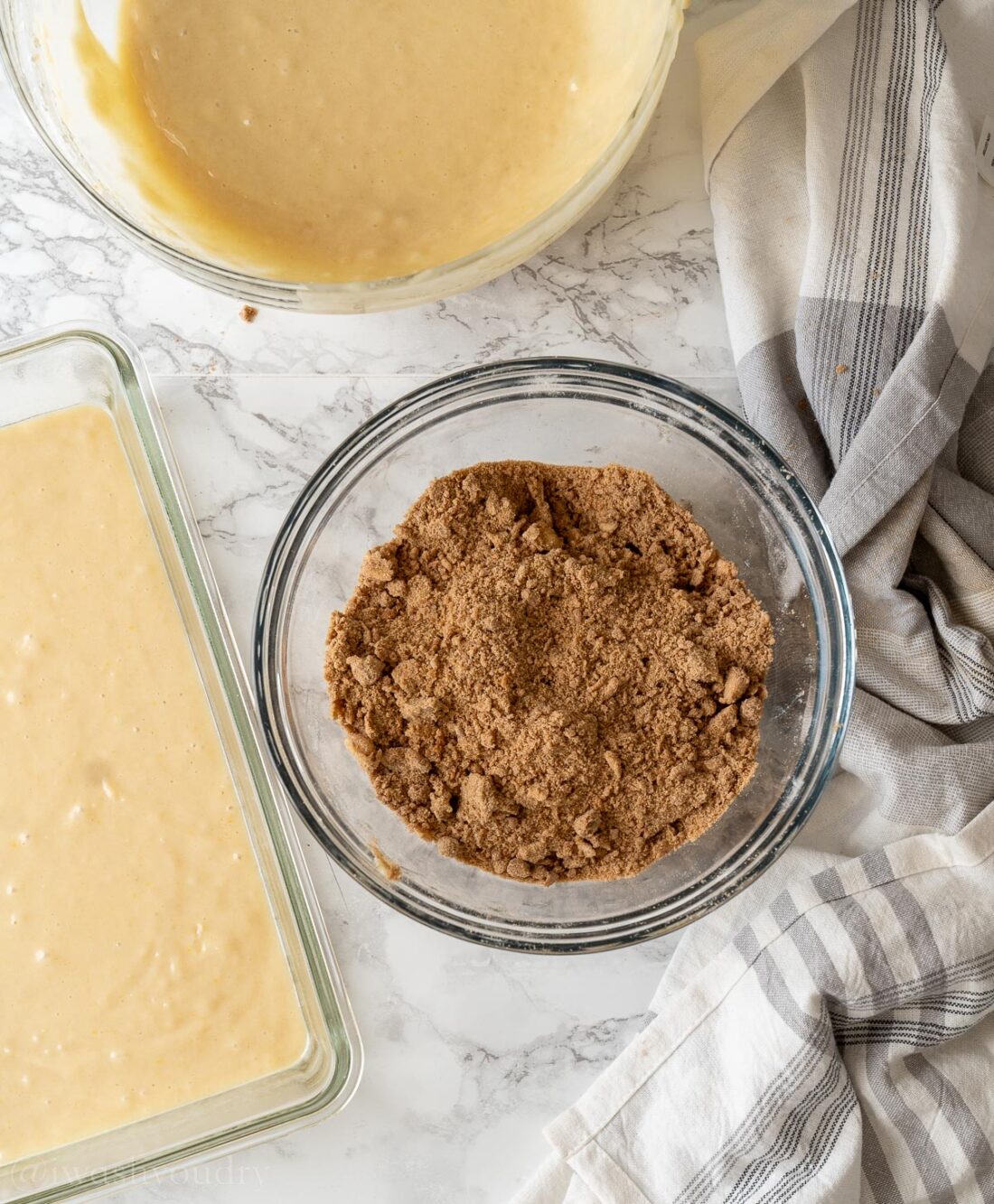 Brown sugar topping crumbled into glass bowl. 