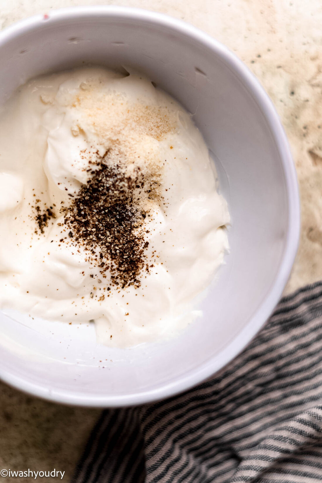 Sour cream, mayo, and spices in small bowl. 