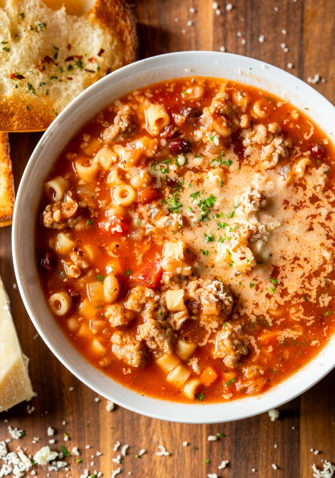 bowl of soup with pasta and sausage.