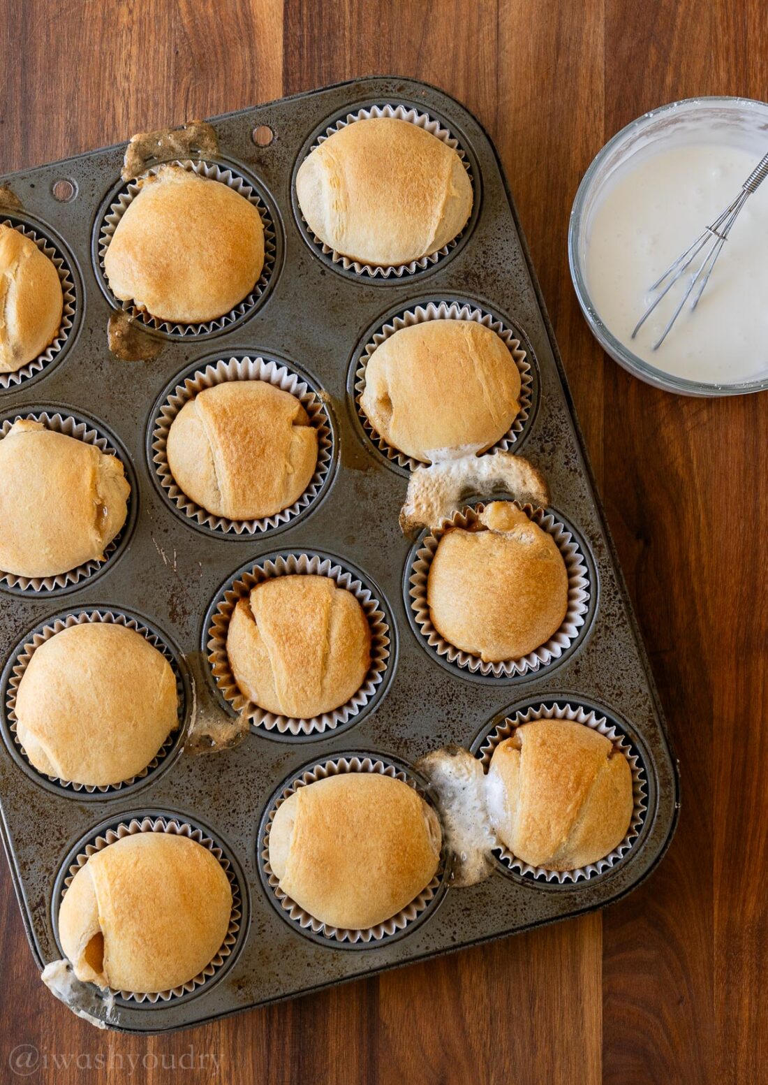 baked resurrection rolls with marshmallow oozing out on pan.