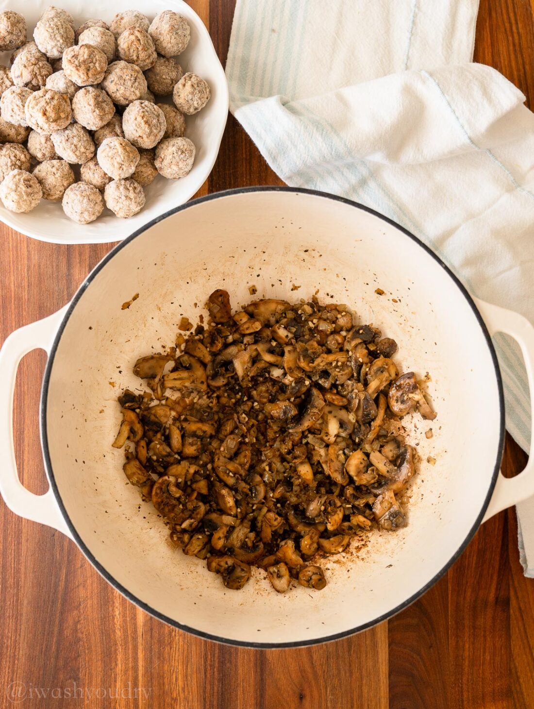 Cooking Mushrooms, onions, and spices in pot.