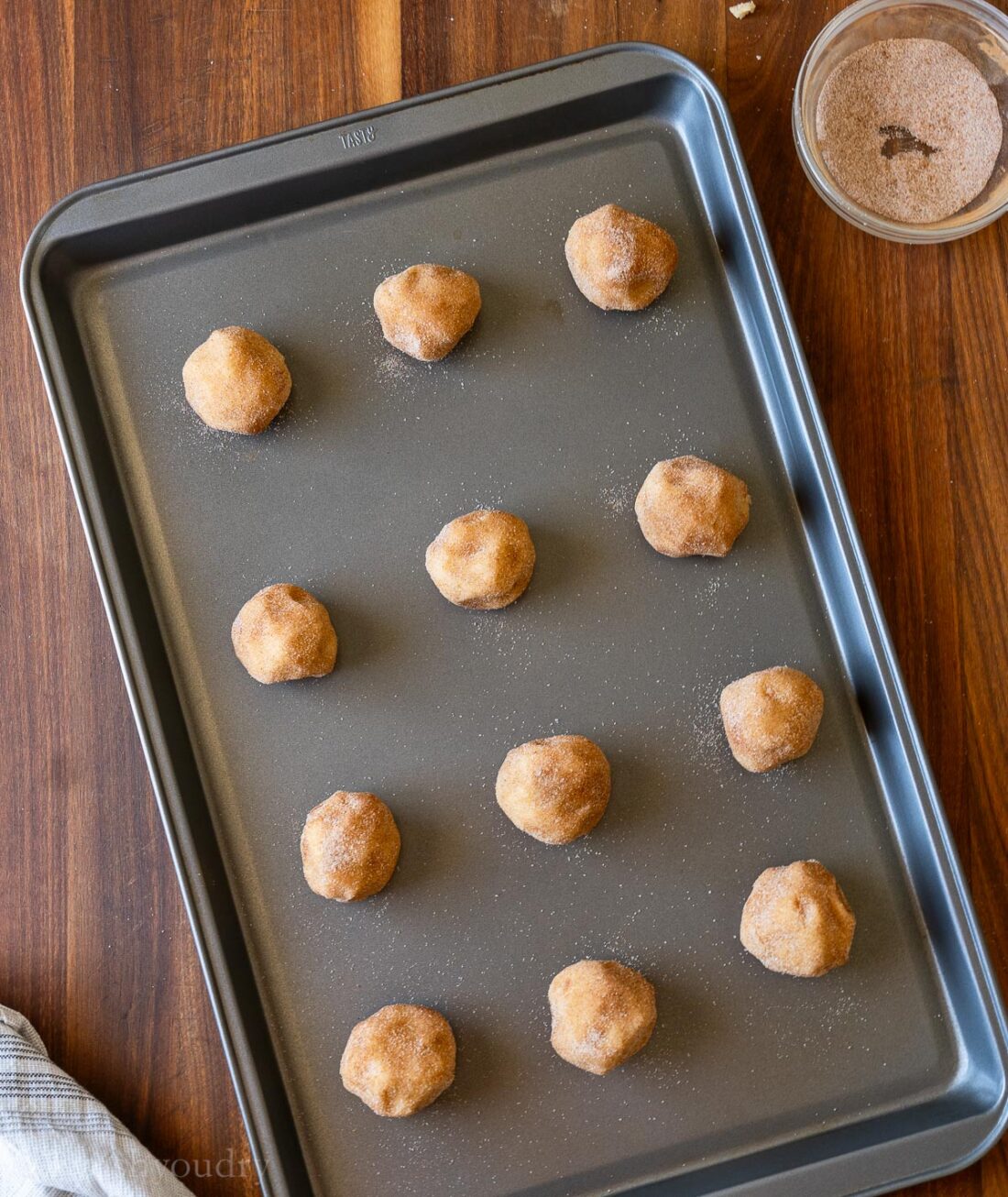 cookie dough rolled in sugar mixture with cinnmaon.