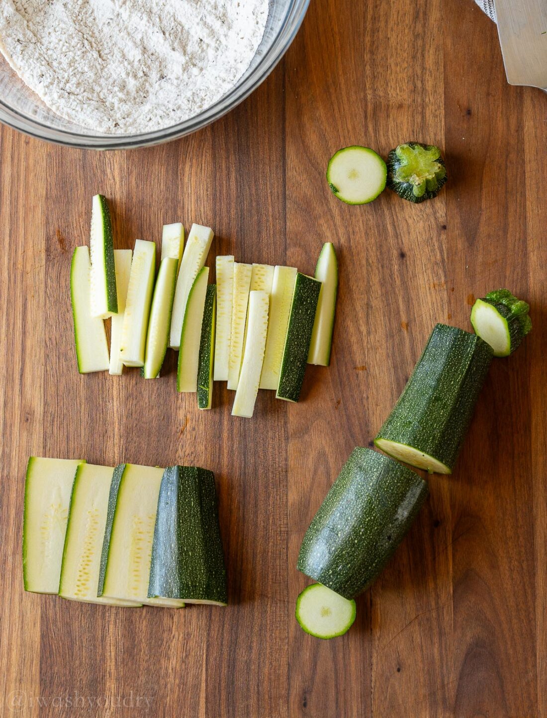 sliced zucchini on wooden surface.